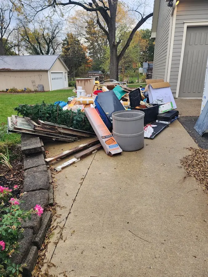 Dumpster being loaded with debris for 10 Yard Dumpster Rental in Alderwood Manor